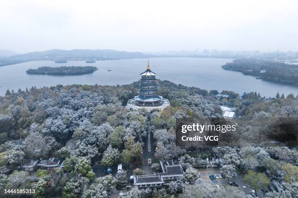 Aerial view of the Leifeng Pagoda, a five story tall tower located on Sunset Hill south of the West Lake, during a heavy snowfall on December 1, 2022...