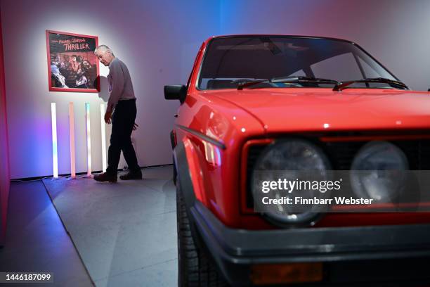 Michael Jackson ‘Thriller’ poster is displayed alongside a 1981 Mark 1 model Golf GTI, on loan from the National Motor Museum, Beaulieu, at the ‘I...