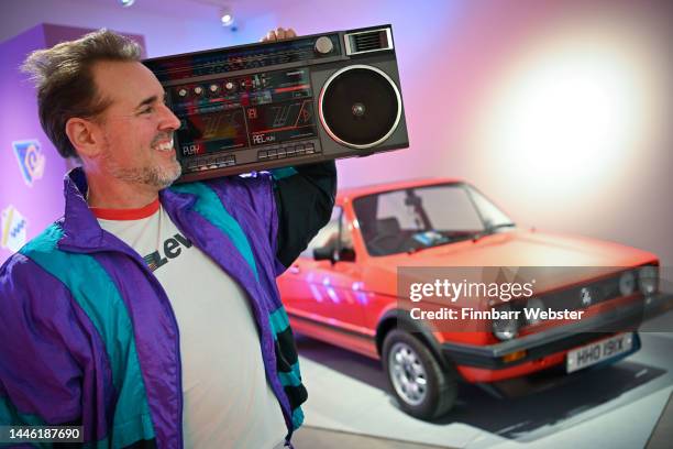 Matt Fox, exhibition curator, poses with a ‘boombox’ and a 1981 Mark 1 model Golf GTI, on loan from the National Motor Museum, Beaulieu, at the ‘I...