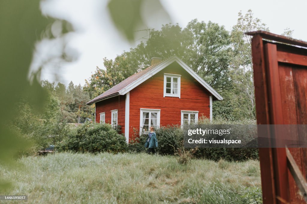 Young woman spending time at her summer cottage
