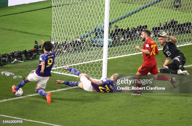 Kaoru Mitoma of Japan keeps the ball in play and passes the ball to Ao Tanaka of Japan to score the team's second goal during the FIFA World Cup...