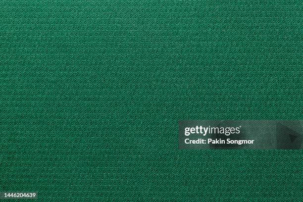 green color sports clothing fabric football shirt jersey texture and textile background. - jersey fabric imagens e fotografias de stock