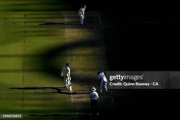 David Warner of Australia bats whilst Kemar Roach of the West Indies bowls during day three of the First Test match between Australia and the West...