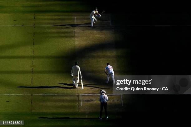 David Warner of Australia bats whilst Kemar Roach of the West Indies bowls during day three of the First Test match between Australia and the West...