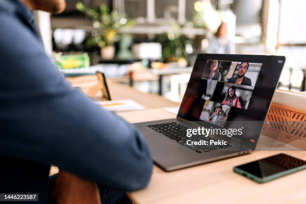 close up of businessman having online meeting in the office - ver stockfoto's en -beelden