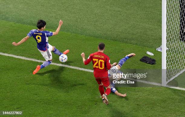Kaoru Mitoma of Japan passes the ball to Ao Tanakaof Japan to score the team's second goal during the FIFA World Cup Qatar 2022 Group E match between...