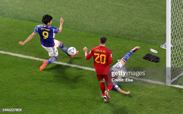 Kaoru Mitoma of Japan passes the ball to Ao Tanakaof Japan to score the team's second goal during the FIFA World Cup Qatar 2022 Group E match between...