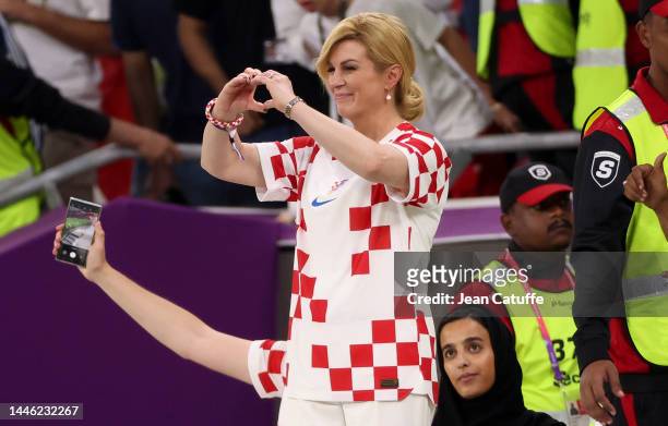 Former President of Croatia Kolinda Grabar-Kitarovic celebrates the victory following the FIFA World Cup Qatar 2022 Group F match between Croatia and...