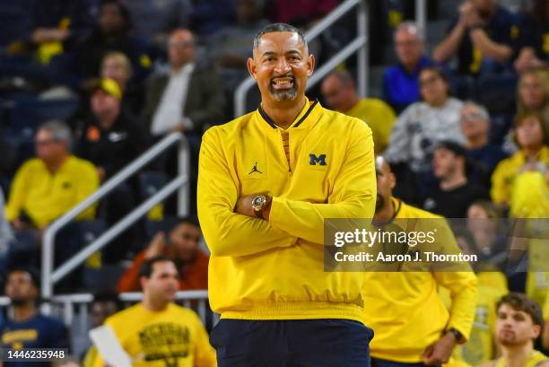 Head Basketball Coach Juwan Howard of the Michigan Wolverines watches a play during the first half of college basketball game against the Virginia...