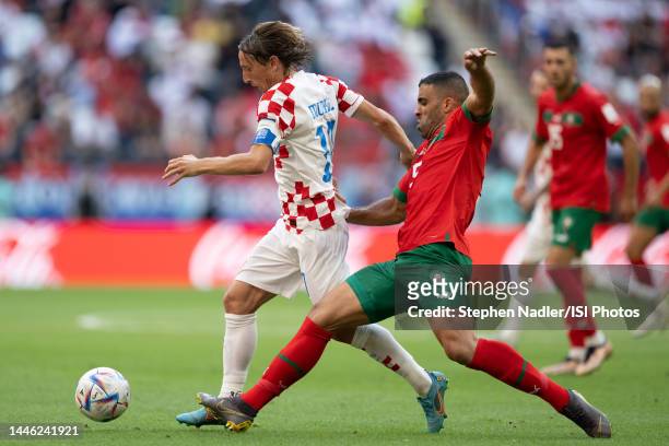 Nayef Aguerd of Morocco and Luka Modric of Croatia battle for the ball during a FIFA World Cup Qatar 2022 Group F match between Morocco and Croatia...