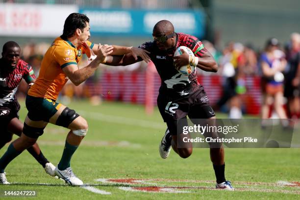 Willy Ambaka of Kenya evades the tackle of Tim Clements of Australia during the match between Australia and Kenya on day one of the HSBC World Rugby...