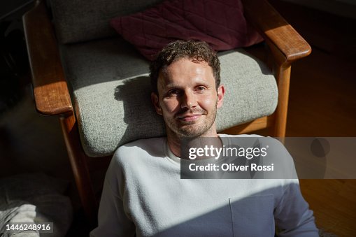 Portrait of confident man relaxing at home Portrait of confident man relaxing at home