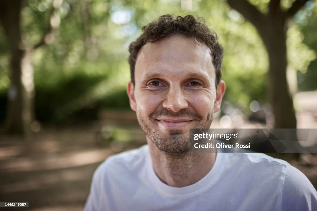Portrait of smiling man in nature