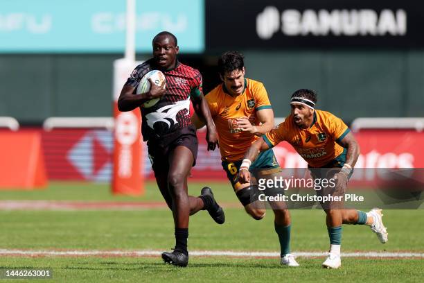 Billy Odhiambo of Kenya runs the ball during the match between Australia and Kenya on day one of the HSBC World Rugby Sevens Series - Dubai at The...