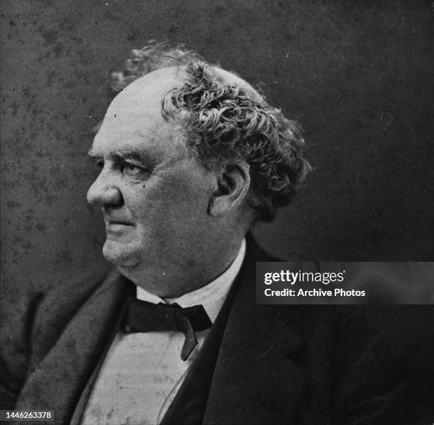 American showman and businessman PT Barnum , co-founder of the Barnum & Bailey Circus, wearing a bow tie with a white shirt and a black jacket,...