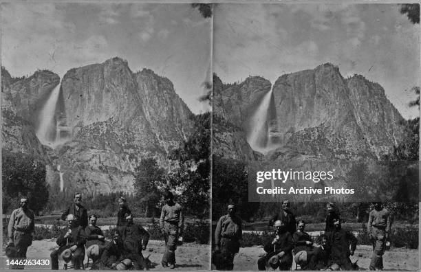 Stereoscopic image showing American showman and businessman PT Barnum , co-founder of the Barnum & Bailey Circus, holding a hat, and party, with...