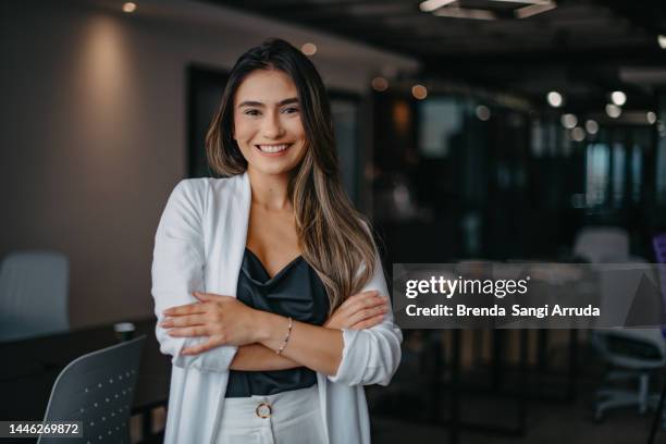 relaxed portrait of young woman inside the company - young business woman bildbanksfoton och bilder