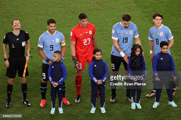 Luis Suarez, Sergio Rochet, Sebastian Coates and Facundo Pellistri of Uruguay line up prior to the FIFA World Cup Qatar 2022 Group H match between...