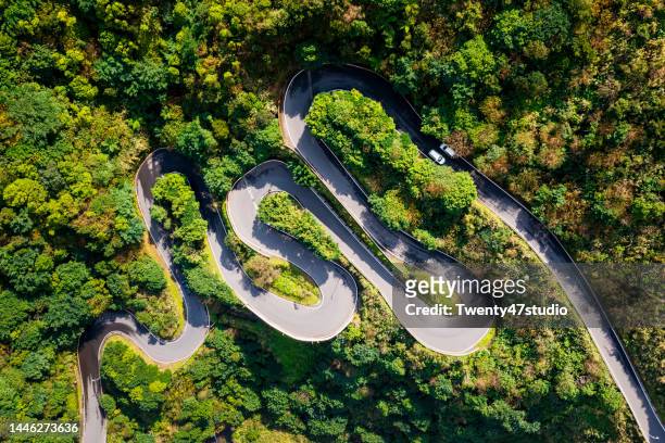 aerial view of winding road in the forest mountain - taiwan landscape stock pictures, royalty-free photos & images