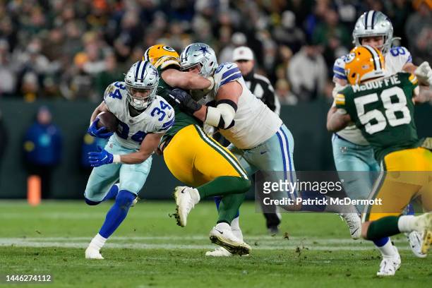 Malik Davis of the Dallas Cowboys runs with the ball against the Green Bay Packers in overtime at Lambeau Field on November 13, 2022 in Green Bay,...