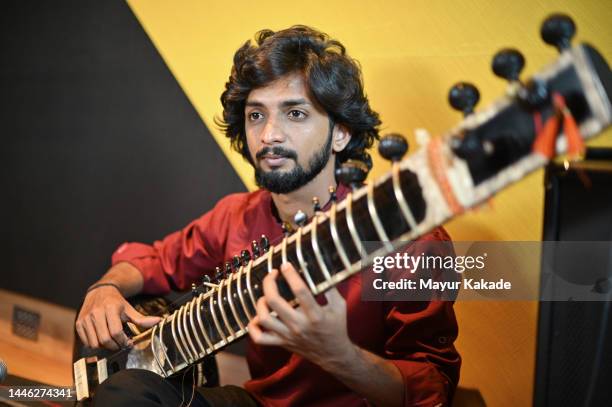 young man playing sitar - classical music stock pictures, royalty-free photos & images