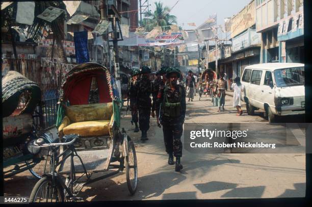 Army troops patrol the street February 26, 1991 in Dhaka, Bangladesh. The first parliamentary elections will be held tomorrow after ten years of...