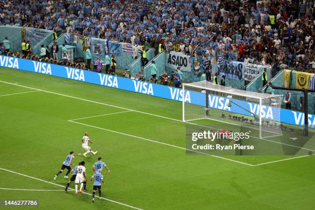 Sergio Rochet of Uruguay saves a penalty taken by Andre Ayew of Ghana during the FIFA World Cup Qatar 2022 Group H match between Ghana and Uruguay at...