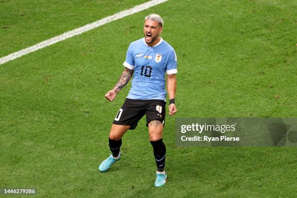 Giorgian de Arrascaeta of Uruguay celebrates after scoring the team's first goal during the FIFA World Cup Qatar 2022 Group H match between Ghana and...