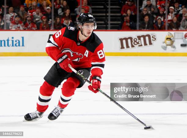 Jack Hughes of the New Jersey Devils skates against the Nashville Predators at the Prudential Center on December 01, 2022 in Newark, New Jersey. The...