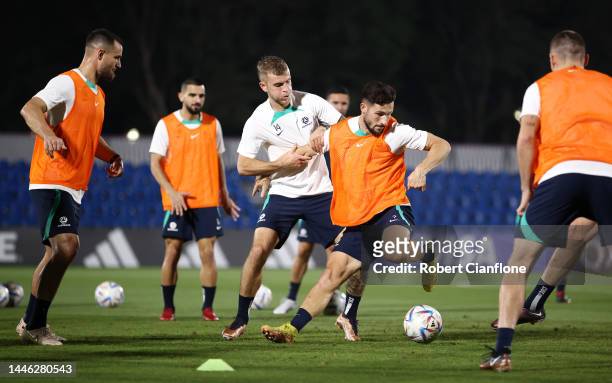 Mathew Leckie and Riley McGree of Australia train during Australia Training Session ahead of their Round of Sixteen match against Argentina at Aspire...