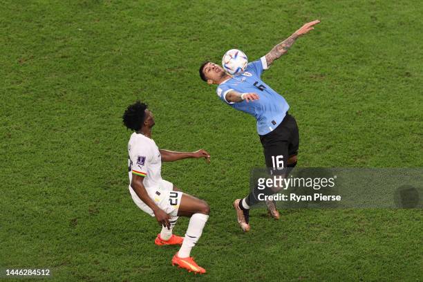 Mathias Olivera of Uruguay controls the ball against Mohammed Kudus of Ghana during the FIFA World Cup Qatar 2022 Group H match between Ghana and...