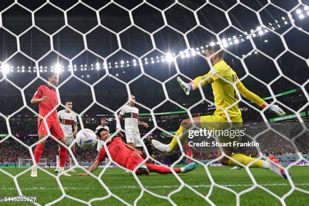 Younggwon Kim of Korea Republic scores the team's first goal past Diogo Costa of Portugal during the FIFA World Cup Qatar 2022 Group H match between...