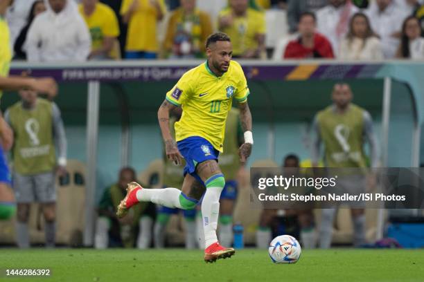 Neymar of Brazil dribbles downfield during a FIFA World Cup Qatar 2022 Group G match between Serbia and Brazil at Lusail Stadium on November 24, 2022...