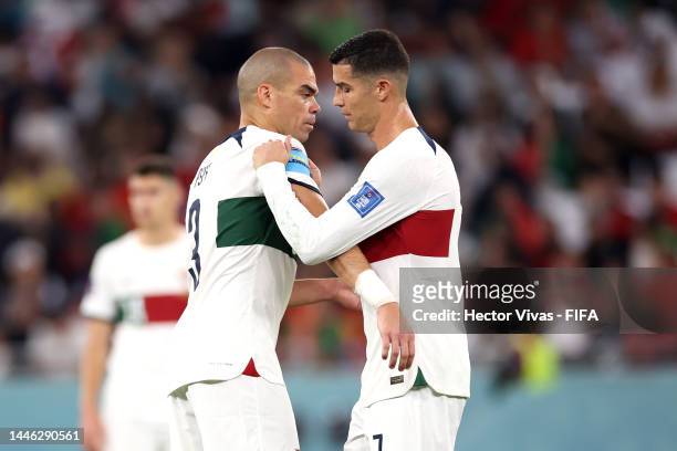 Cristiano Ronaldo of Portugal hands over the captain's armband to Pepe during the FIFA World Cup Qatar 2022 Group H match between Korea Republic and...