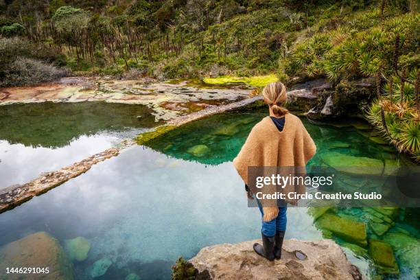 young woman looking at hot springs  water - colombia mountains stock pictures, royalty-free photos & images