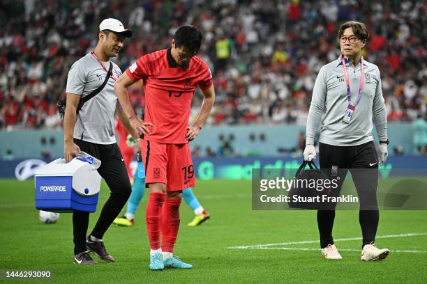 Younggwon Kim of Korea Republic receives medical treatment during the FIFA World Cup Qatar 2022 Group H match between Korea Republic and Portugal at...