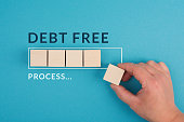 Debt free in process are standing next to the loading bar, ending credit payments and bank loans, financial freedom