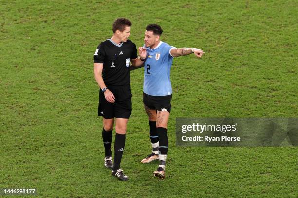 Jose Maria Gimenez of Uruguay protests to Referee Daniel Siebert after the FIFA World Cup Qatar 2022 Group H match between Ghana and Uruguay at Al...