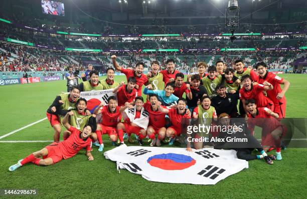Korea Republic players celebrate after the 2-1 win during the FIFA World Cup Qatar 2022 Group H match between Korea Republic and Portugal at...
