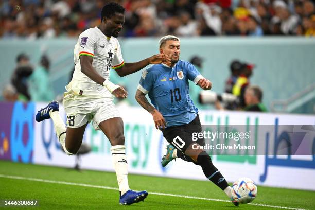 Giorgian de Arrascaeta of Uruguay controls the ball against Daniel Amartey of Ghana during the FIFA World Cup Qatar 2022 Group H match between Ghana...