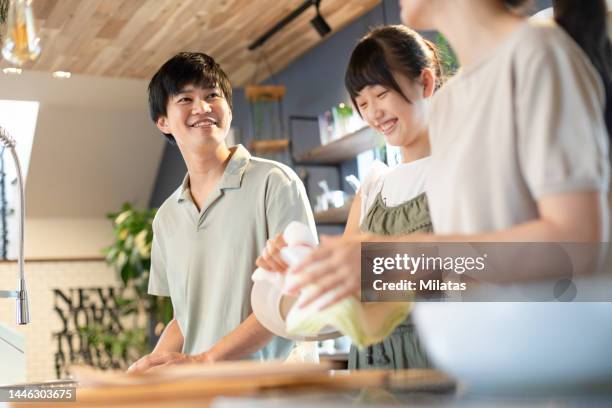 family standing in the kitchen - only japanese stock pictures, royalty-free photos & images