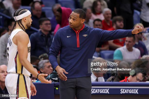 Head coach Willie Green of the New Orleans Pelicans and Jose Alvarado react against the Oklahoma City Thunder during a game at the Smoothie King...