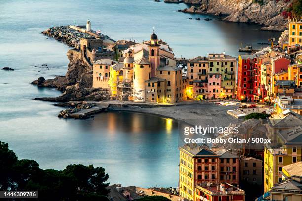 high angle view of illuminated buildings by sea,camogli,genoa,italy - genova foto e immagini stock