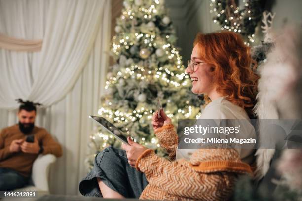 newlyweds using digital technology on christmas - christmas background no people stock pictures, royalty-free photos & images