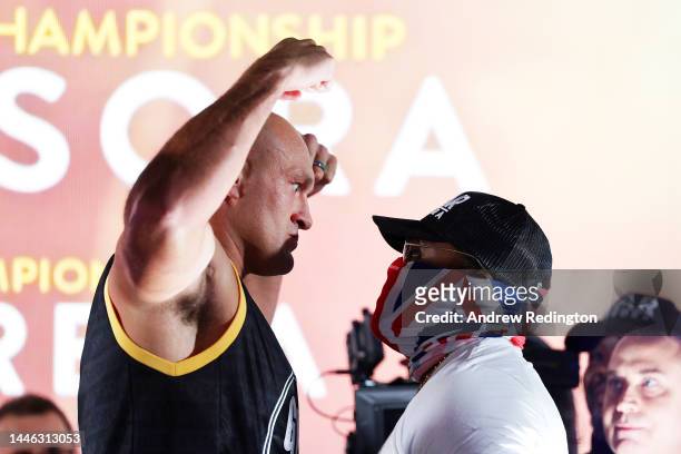 Tyson Fury and Derek Chisora face off during the Tyson Fury v Derek Chisora: Weigh-In at Business Design Centre on December 02, 2022 in London,...