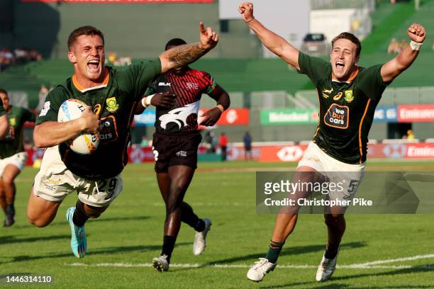 Ricardo Duarttee of South Africa celebrates scoring a try with teammate James Murphy during the match between South Africa and Kenya on day one of...