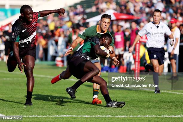 Johnstone Olindi of Kenya is tackled by Muller du Plessis of South Africa during the match between South Africa and Kenya on day one of the HSBC...