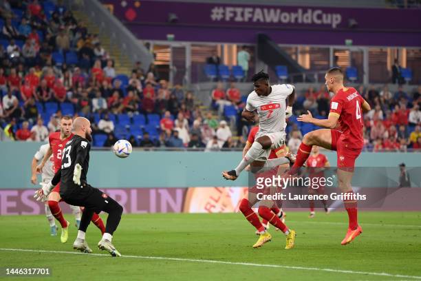 Vanja Milinkovic-Savic of Serbia makes a save the shot by Breel Embolo of Switzerland during the FIFA World Cup Qatar 2022 Group G match between...