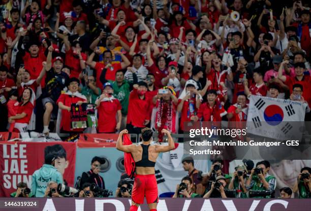 Hwang Hee-chan of South Korea celebrates after scoring his team's second goal with his team infront of the supporters during the FIFA World Cup Qatar...