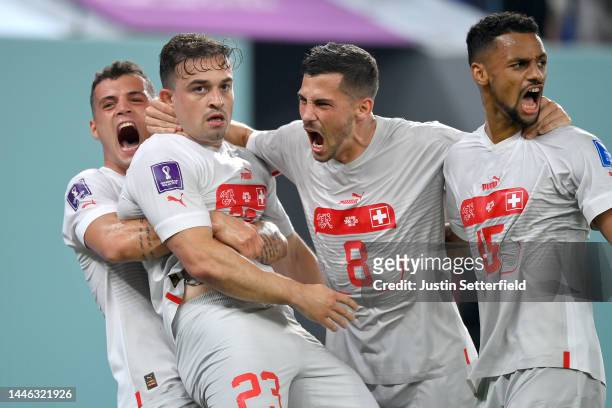 Xherdan Shaqiri of Switzerland celebrates with teammates after scoring the team’s first goal during the FIFA World Cup Qatar 2022 Group G match...